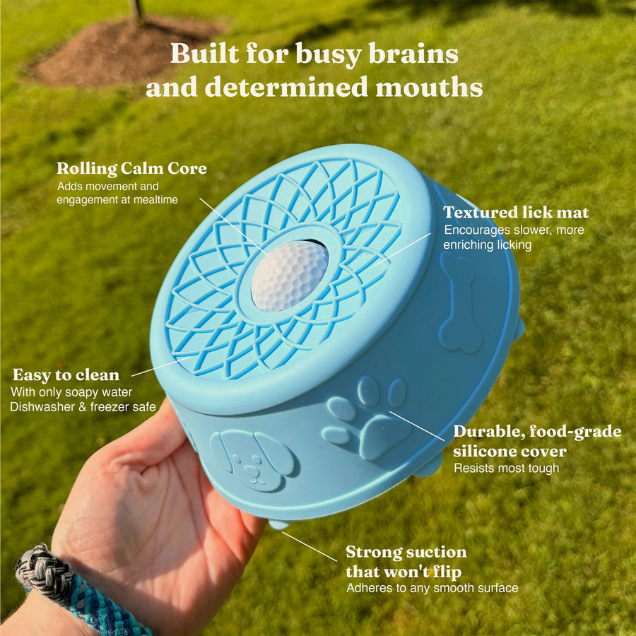 Feature diagram of the Hush Bowl: rolling centre ball, textured lick mat, food-grade silicone cover and suction base that will not flip